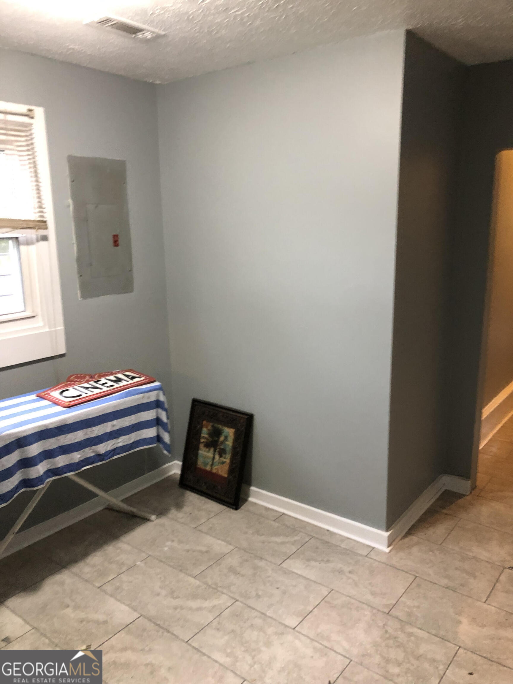 821 Beckwith Street Southwest Atlanta, GA 30314 - Photo 7 of 16 a bedroom with a bed and a window