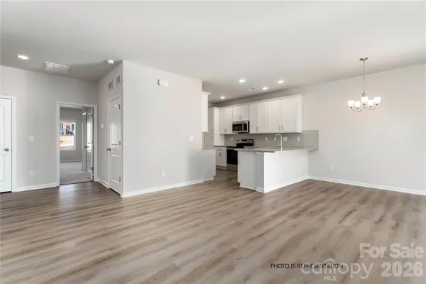 a view of kitchen with wooden floor