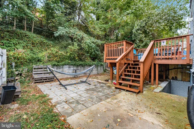 a view of a chair and table in the balcony