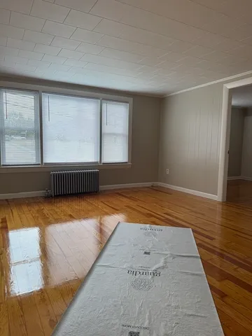 an empty room with an empty room and window