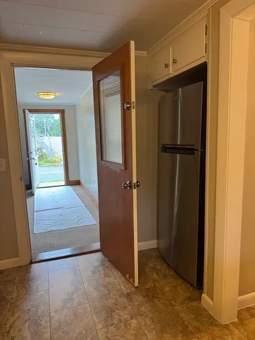 an empty room with mirror