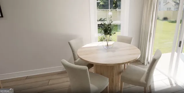 a dining room with furniture and window