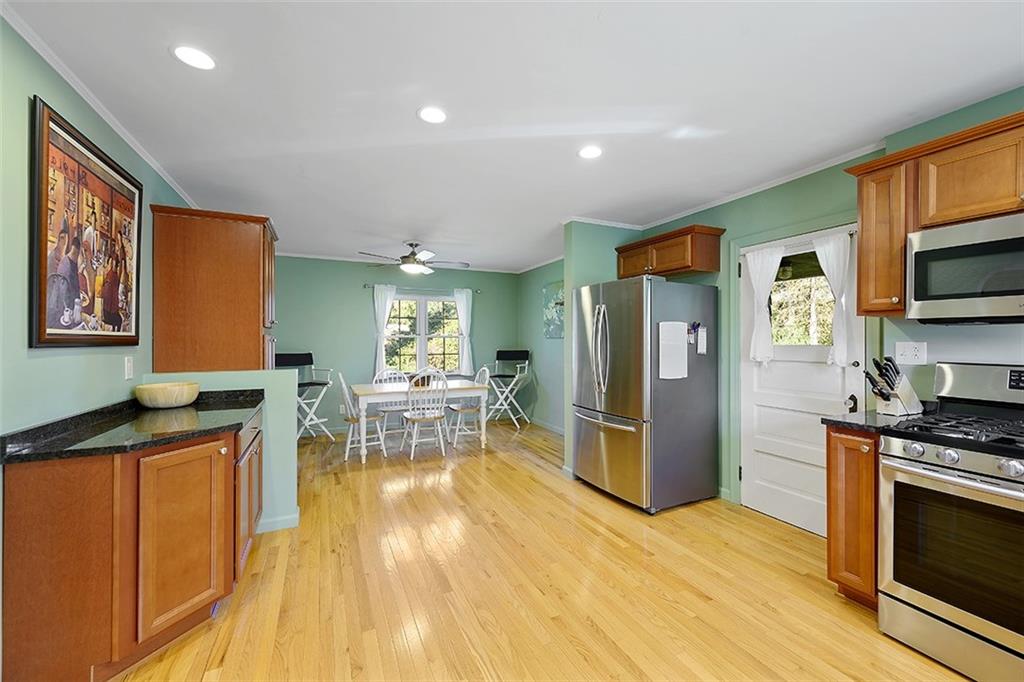2016 Ridge Rd Extension Ambridge, PA 15003 - Photo 11 of 25 a kitchen with stainless steel appliances granite countertop a refrigerator and a stove top oven