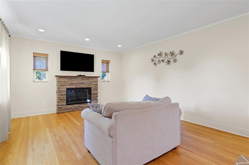 2016 Ridge Rd Extension Ambridge, PA 15003 - Photo 7 of 25 a living room with furniture a flat screen tv and a fireplace