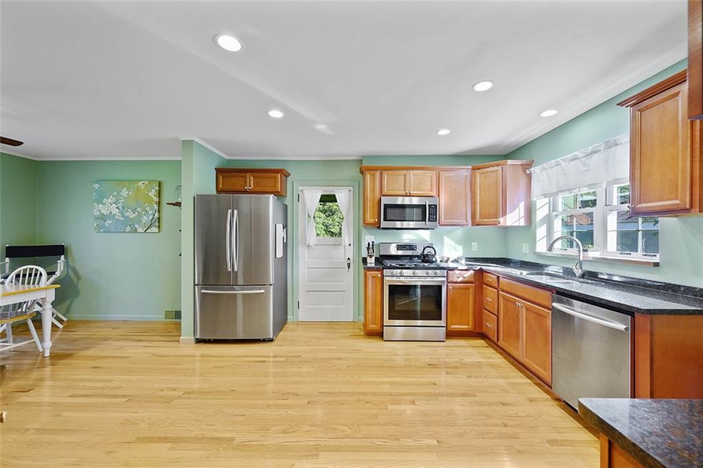 2016 Ridge Rd Extension Ambridge, PA 15003 - Photo 9 of 25 a kitchen with stainless steel appliances granite countertop a refrigerator and a stove top oven