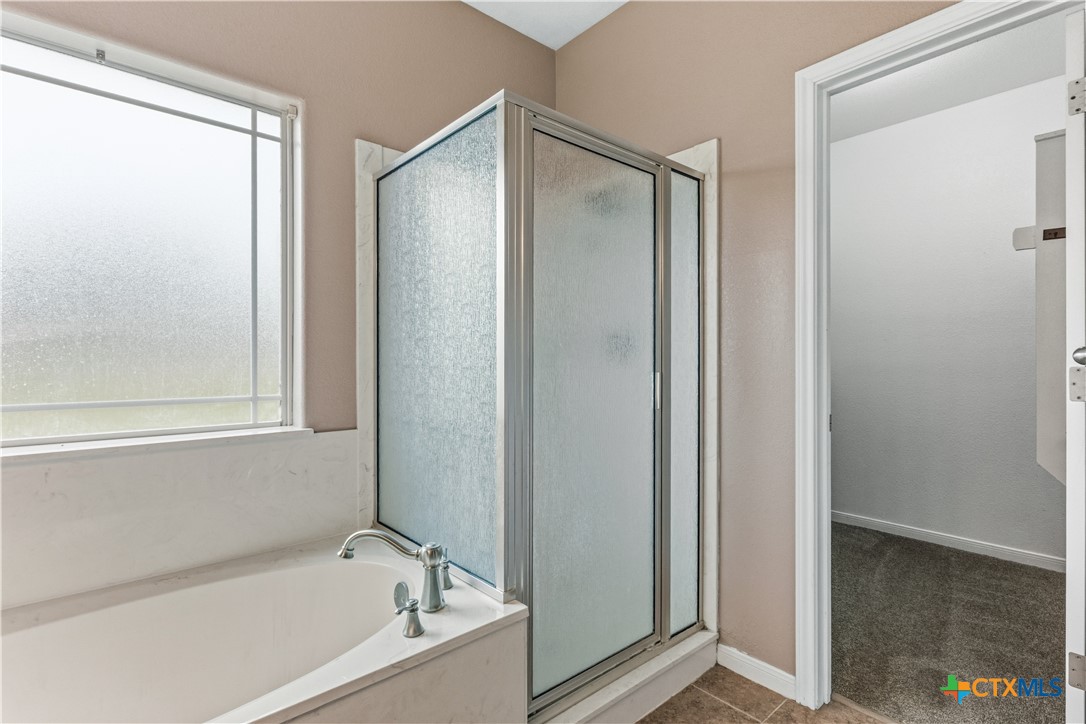 283 County Road 4710 Kempner, TX 76539 - Photo 27 of 47 a bathroom with a bathtub and a shower
