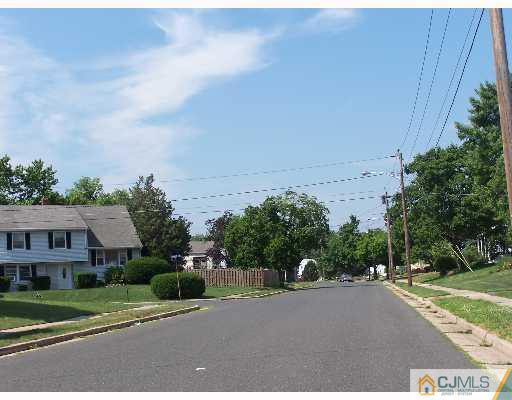 26 Lexington Road Somerset, NJ 08873 - Photo 4 of 10 a view of a street with a building in the background