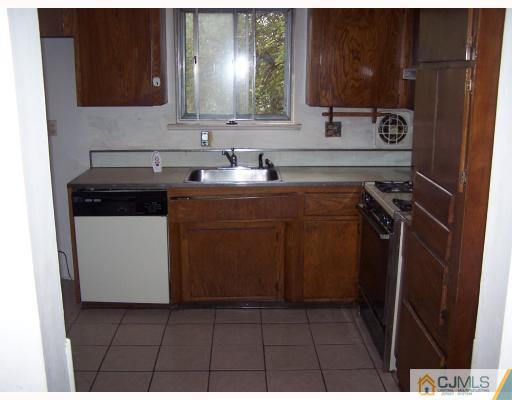 26 Lexington Road Somerset, NJ 08873 - Photo 6 of 10 a utility room with a sink a washer and dryer