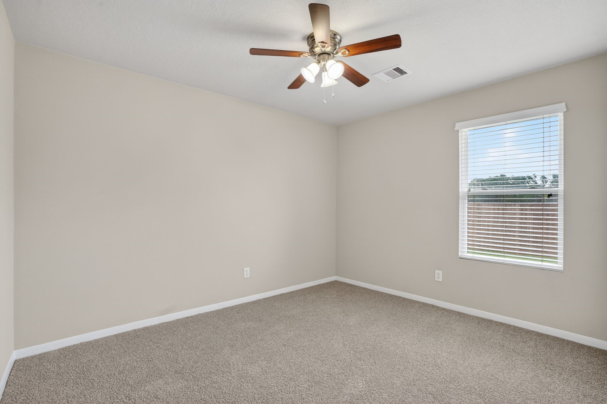 29414 Winton Wood Way Spring, TX 77386 - Photo 26 of 35 an empty room with a window and a fan