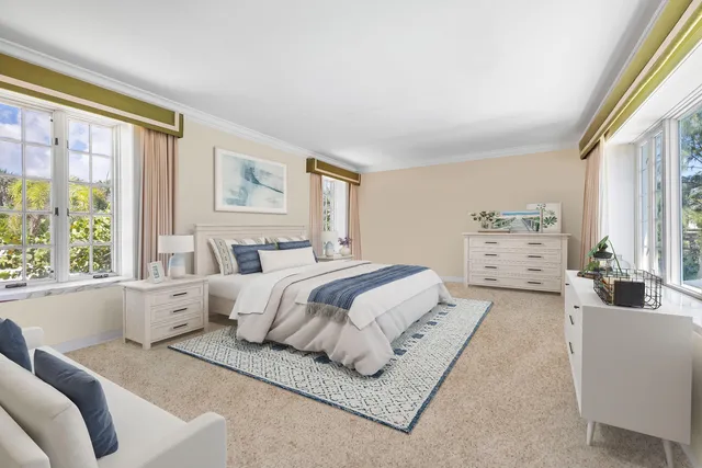 a spacious bedroom with a large bed and a large window