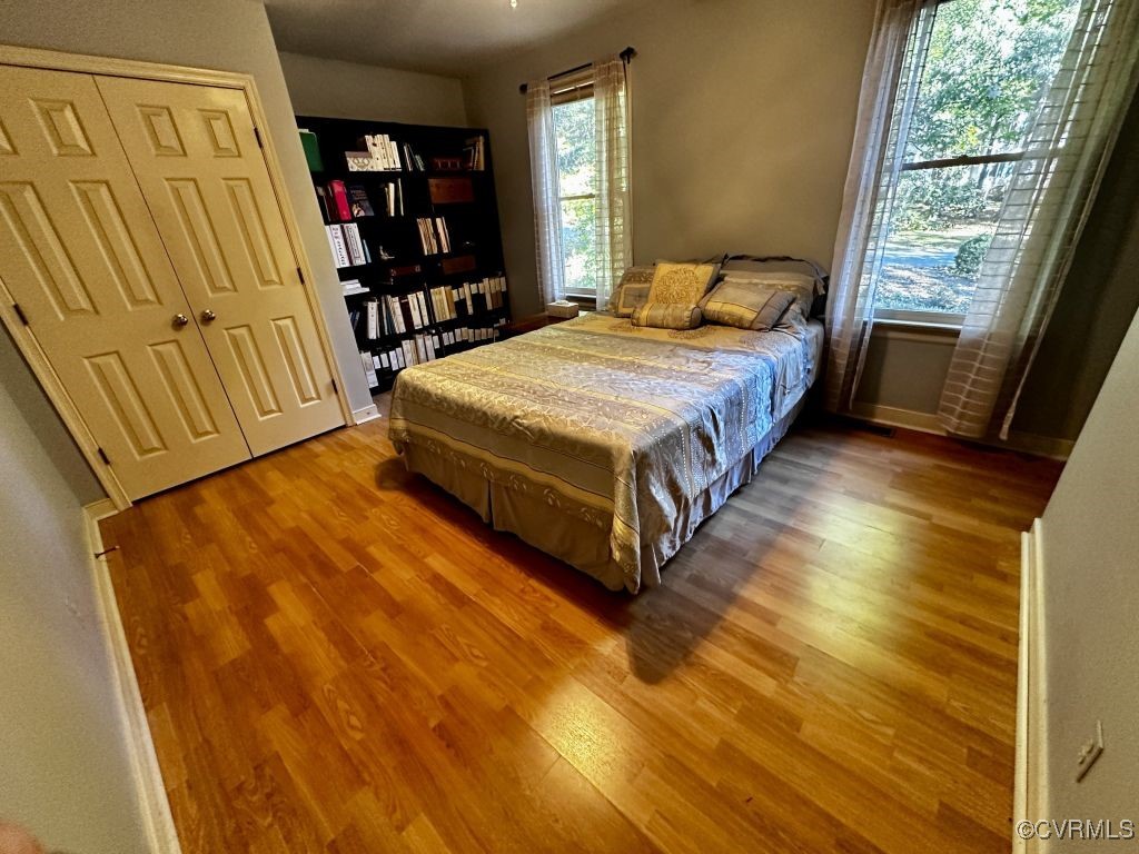 14326 Huntgate Woods Road Midlothian, VA 23112 - Photo 20 of 25 Bedroom with hardwood / wood-style floors and a cl