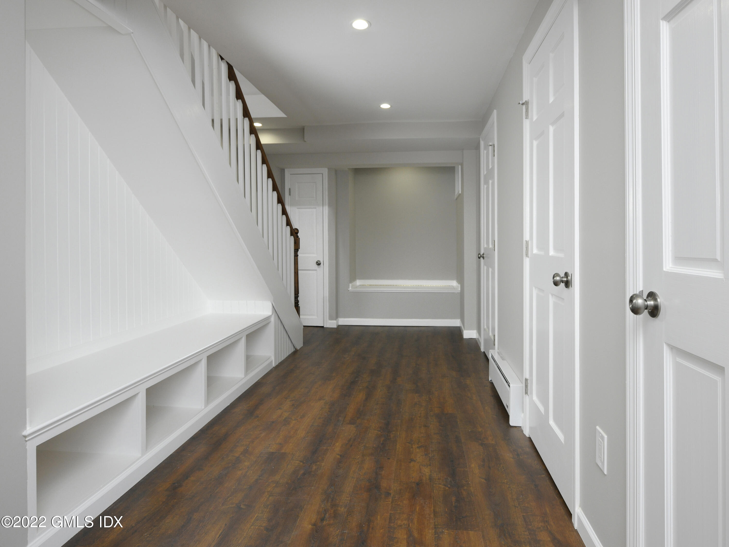 7 Butler Street Cos Cob, CT 06807 - Photo 13 of 18 a view of a hallway with wooden floor and entryway