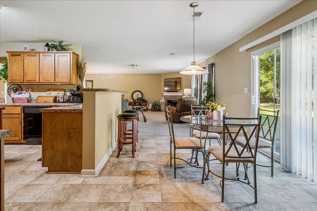 a view of kitchen with furniture and window