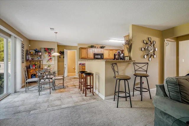 a view of a livingroom with furniture and a flat screen tv