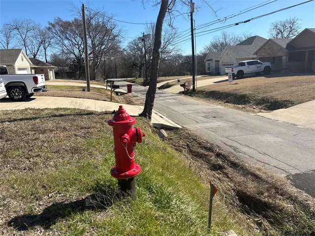 a view of a yard with cars