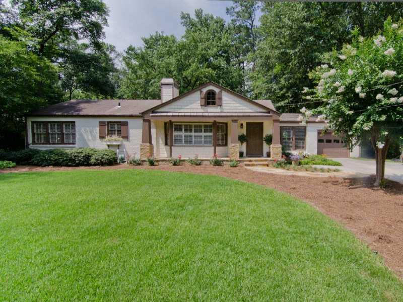 1175 Pine Ridge Road Northeast Atlanta, GA 30324 - Photo 1 of 1 a front view of house with yard and green space