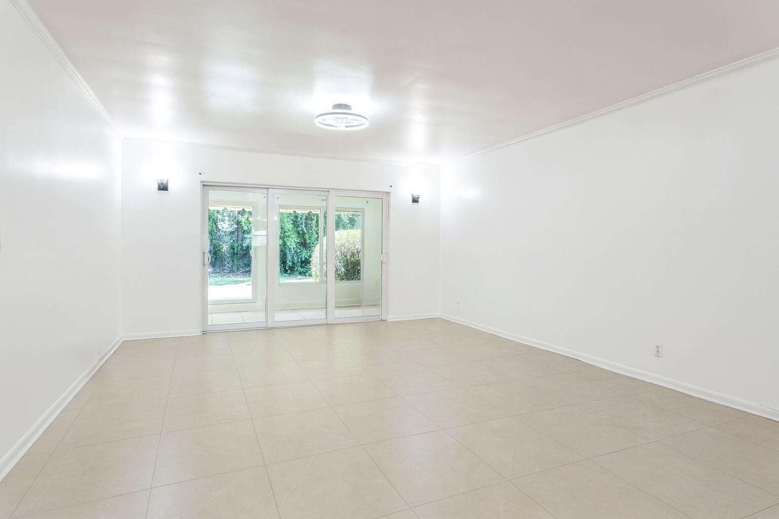 1217 Surf Road, Unit 2 Singer Island, FL 33404 - Photo 6 of 18 an empty room with window