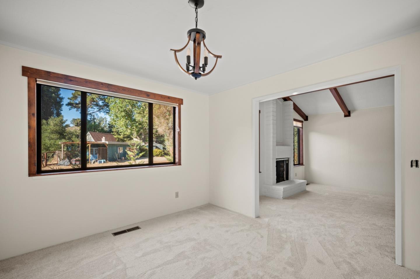 59 Boronda Road Carmel Valley, CA 93924 - Photo 13 of 43 a view of a room with rack on the wall and a large window