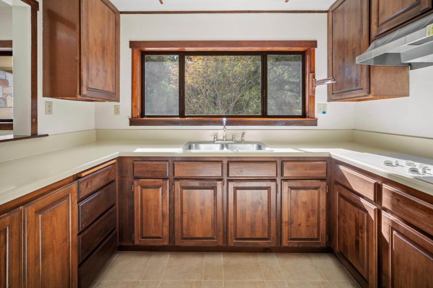 59 Boronda Road Carmel Valley, CA 93924 - Photo 16 of 43 a kitchen with a sink and a window