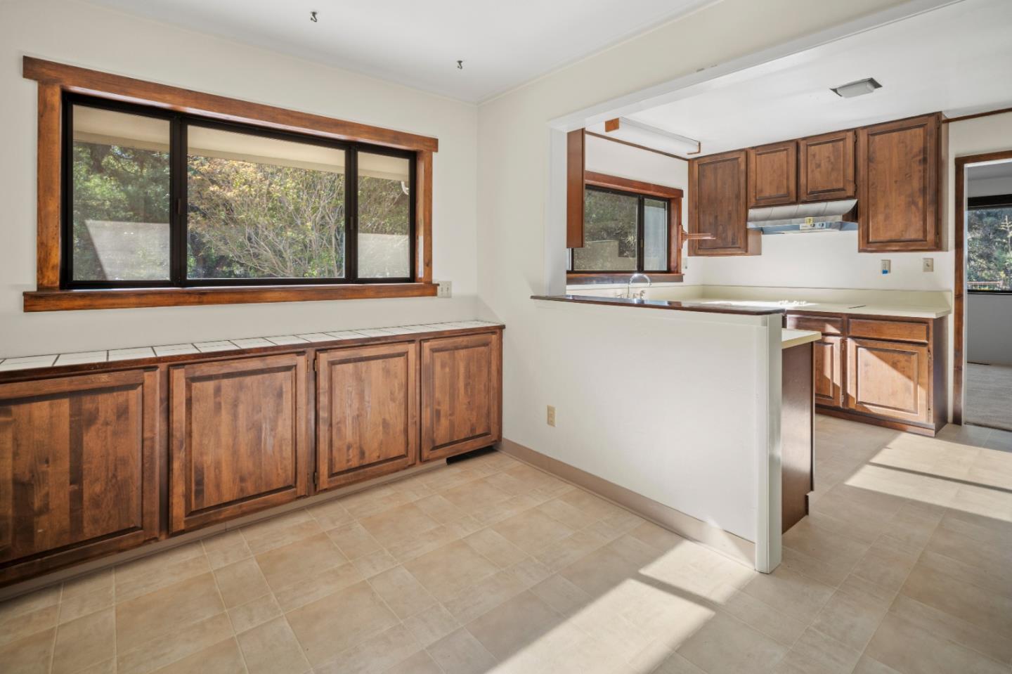 59 Boronda Road Carmel Valley, CA 93924 - Photo 18 of 43 a kitchen with stainless steel appliances granite countertop a stove a sink and a microwave