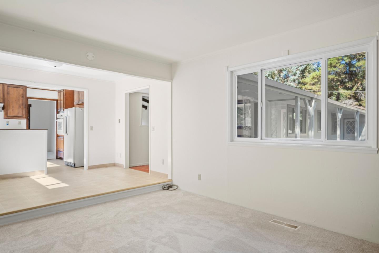 59 Boronda Road Carmel Valley, CA 93924 - Photo 19 of 43 a view of an empty room with a window