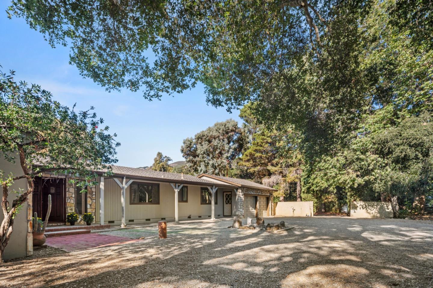 59 Boronda Road Carmel Valley, CA 93924 - Photo 2 of 43 a front view of a house with a patio