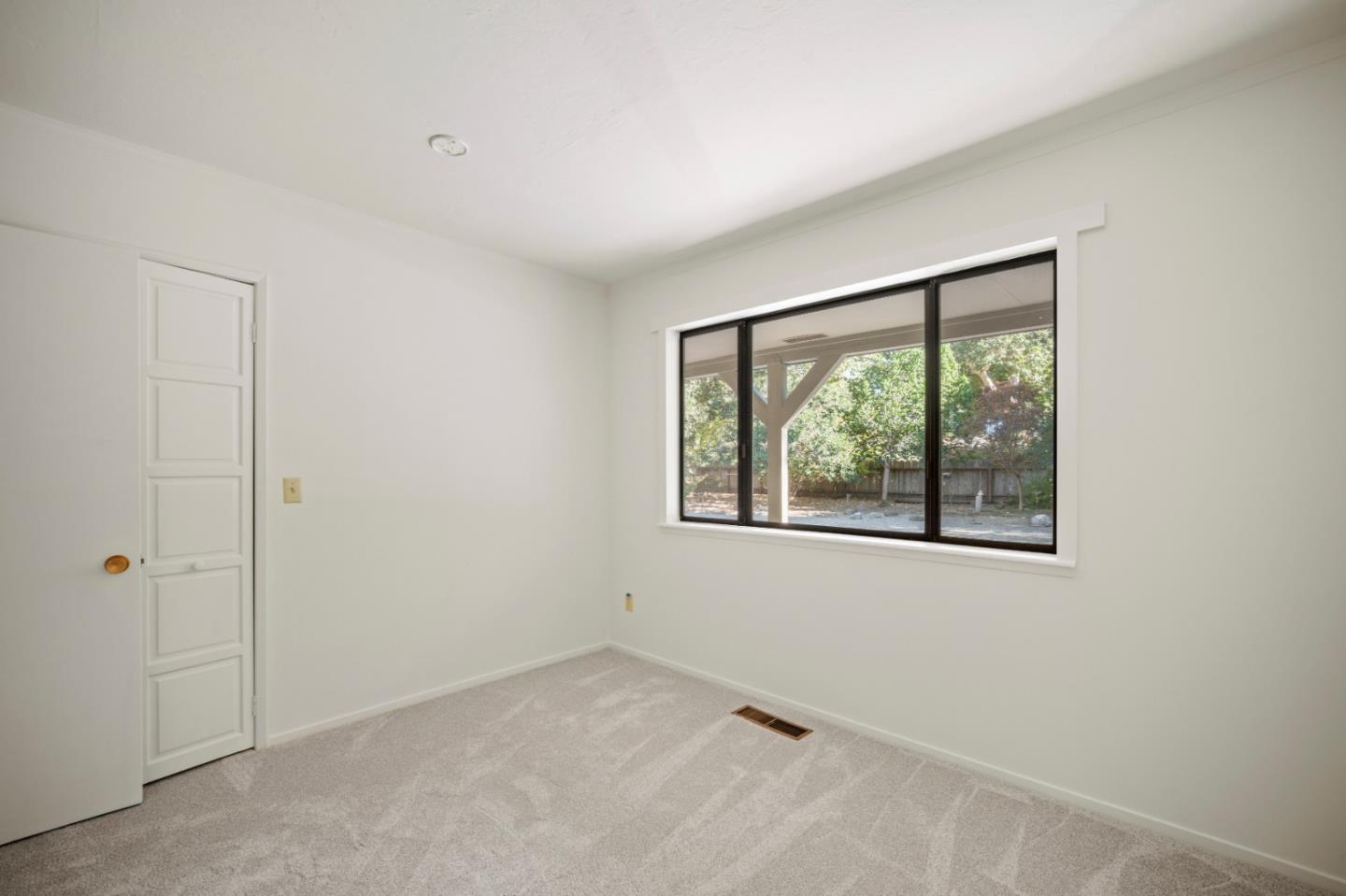 59 Boronda Road Carmel Valley, CA 93924 - Photo 27 of 43 an empty room with a window