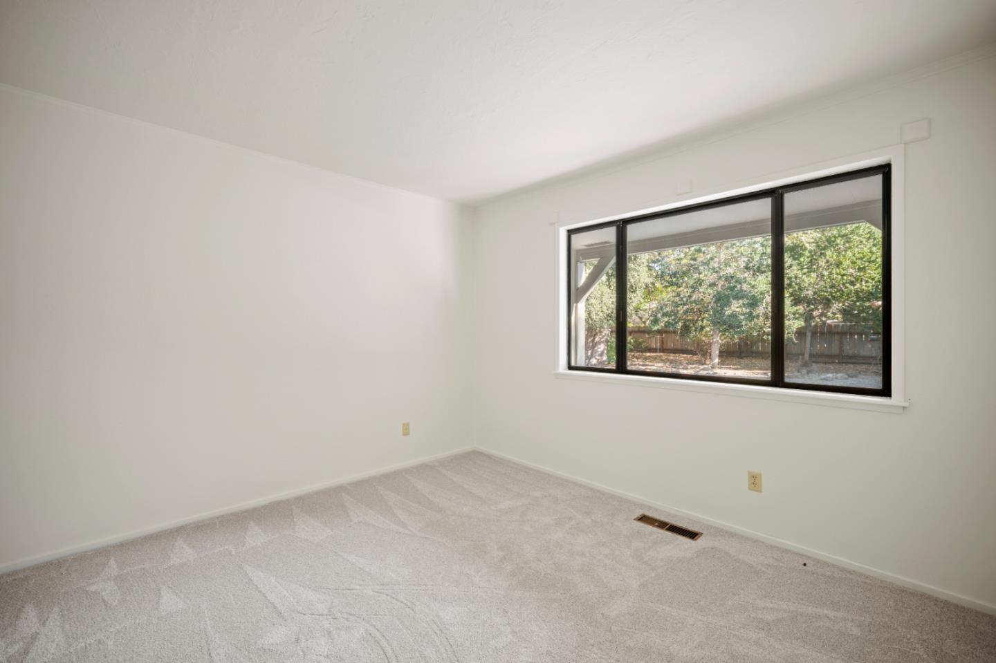 59 Boronda Road Carmel Valley, CA 93924 - Photo 30 of 43 an empty room with a window
