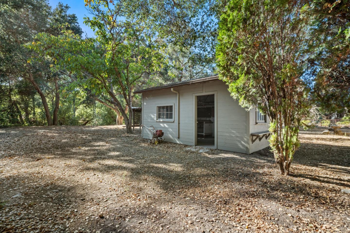 59 Boronda Road Carmel Valley, CA 93924 - Photo 33 of 43 a view of a house with a yard