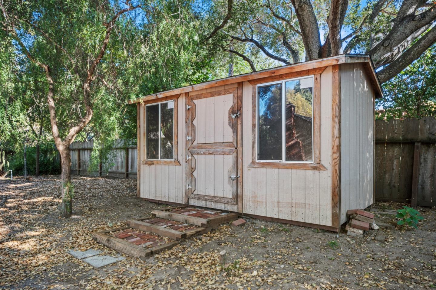59 Boronda Road Carmel Valley, CA 93924 - Photo 38 of 43 a view of a house with a yard
