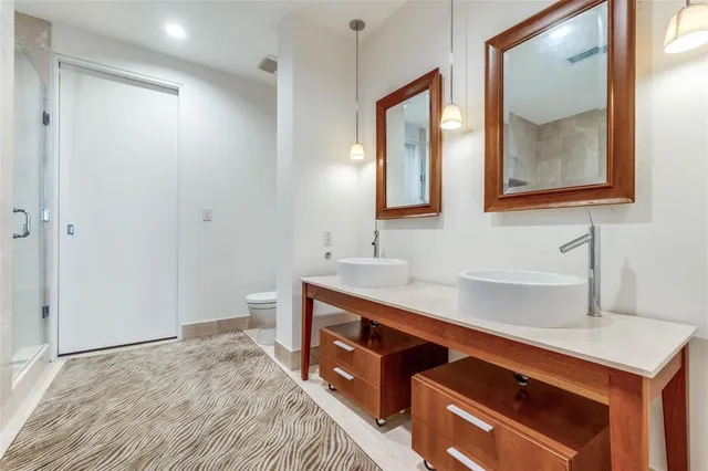 a bathroom with a sink a vanity and a mirror