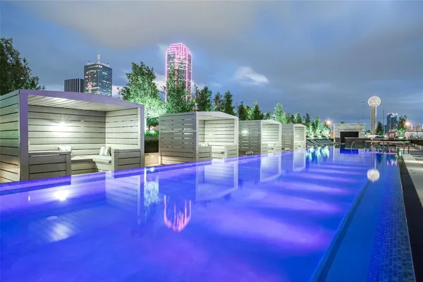 a view of swimming pool with outdoor seating