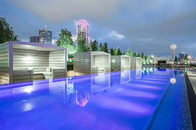 a view of swimming pool with outdoor seating
