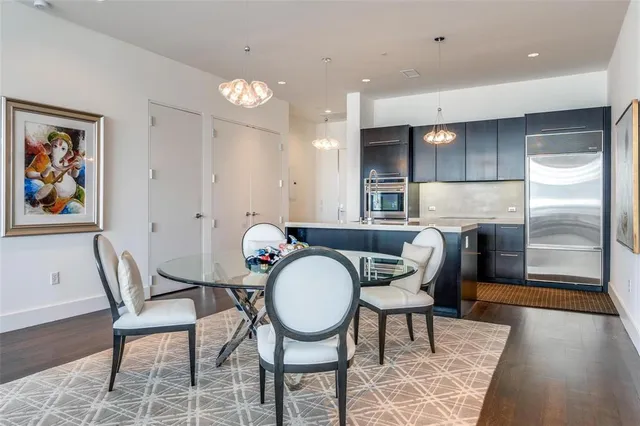 a dining room with furniture and a chandelier