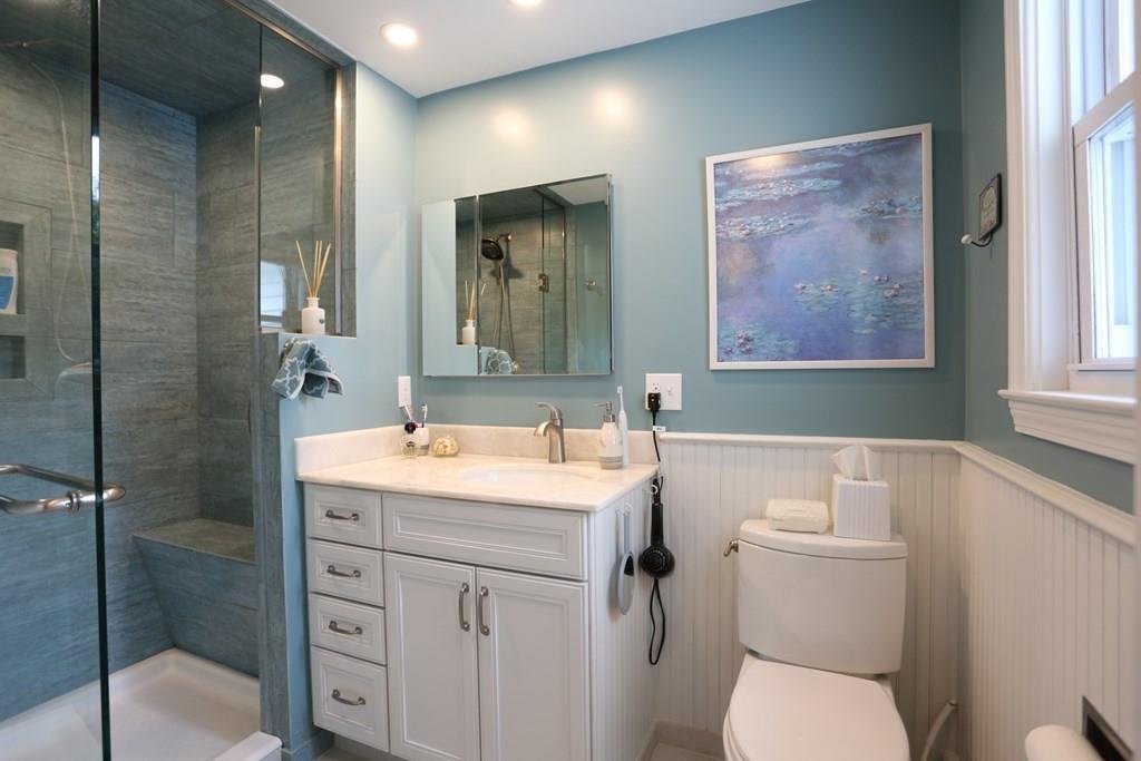69 Border Road Needham, MA 02492 - Photo 10 of 20 a bathroom with a toilet sink and mirror