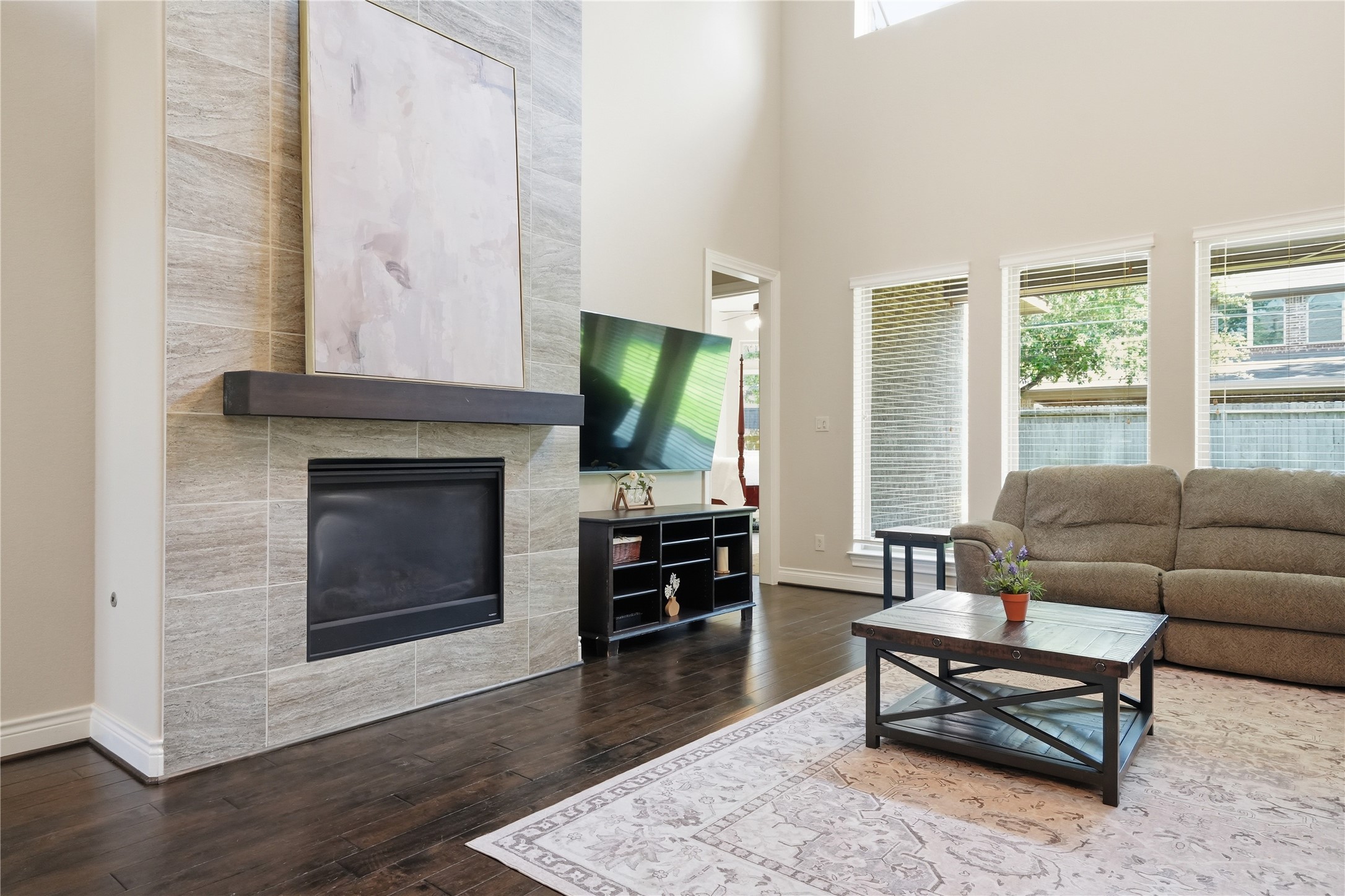 6429 Remlap Street Houston, TX 77055 - Photo 10 of 30 Spacious formal living area with soaring ceilings, abundant natural light, and a sleek fireplace.