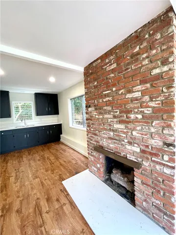 a living room with fireplace furniture and a flat screen tv