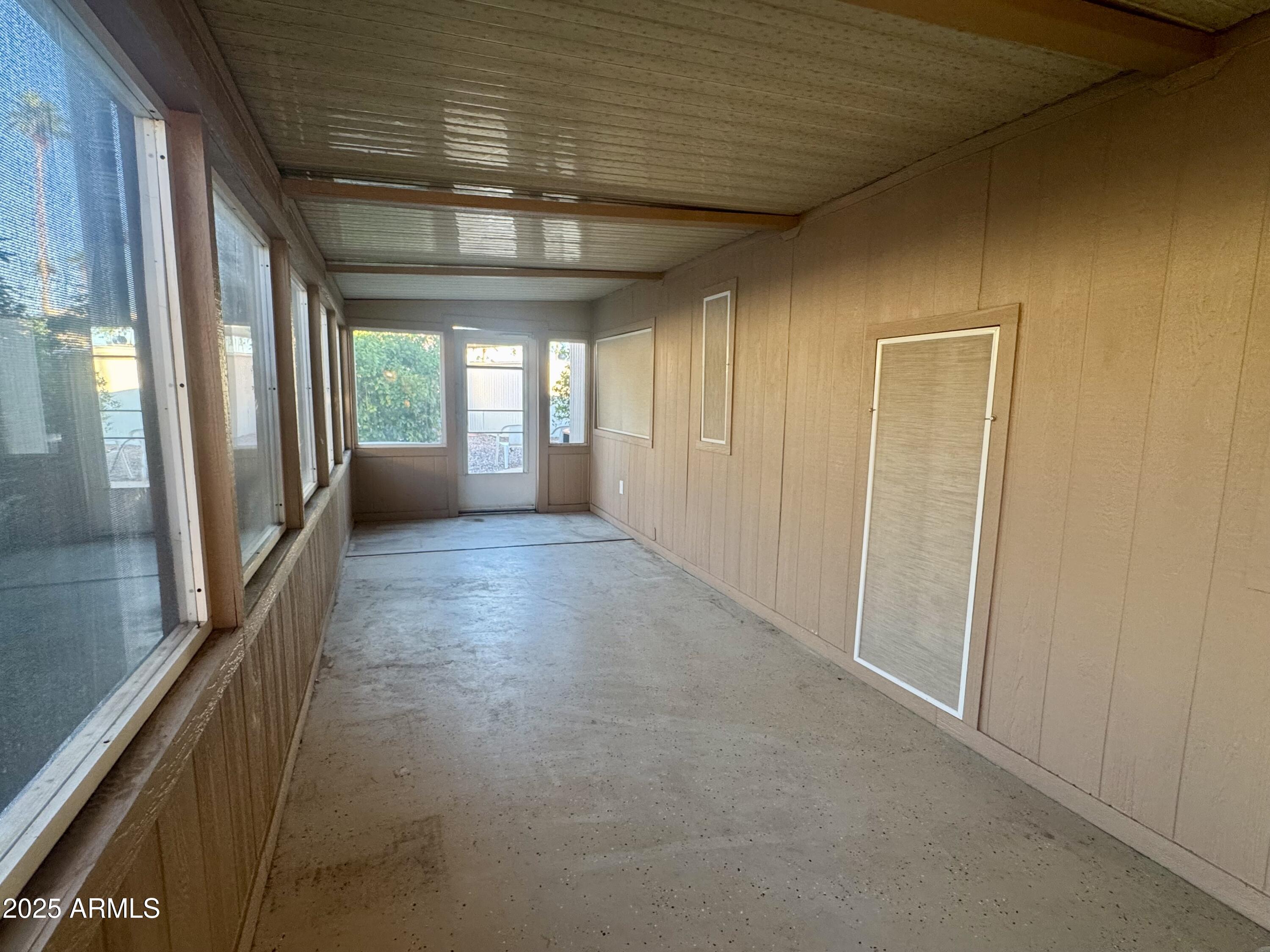 303 South Recker Road, Unit 215 Mesa, AZ 85206 - Photo 15 of 19 a view of a hallway with a window