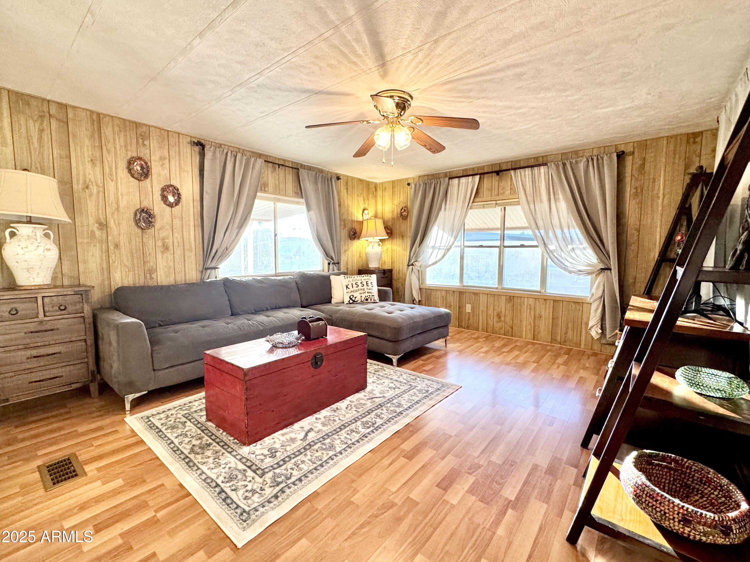 303 South Recker Road, Unit 215 Mesa, AZ 85206 - Photo 5 of 19 a living room with furniture and a large window