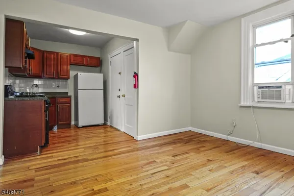 a view of kitchen with wooden floor