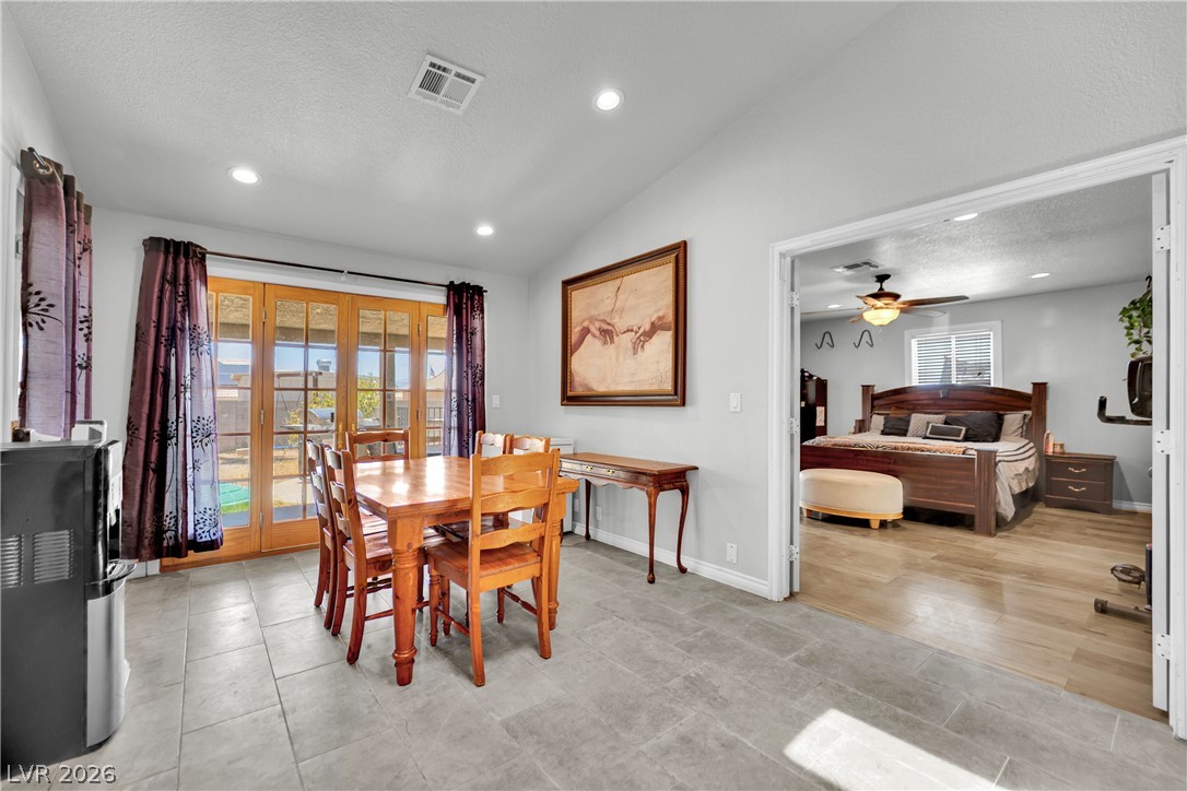 420 North Racetrack Road Henderson, NV 89015 - Photo 21 of 52 French doors open to outdoor space, complementing the generously sized dining area.