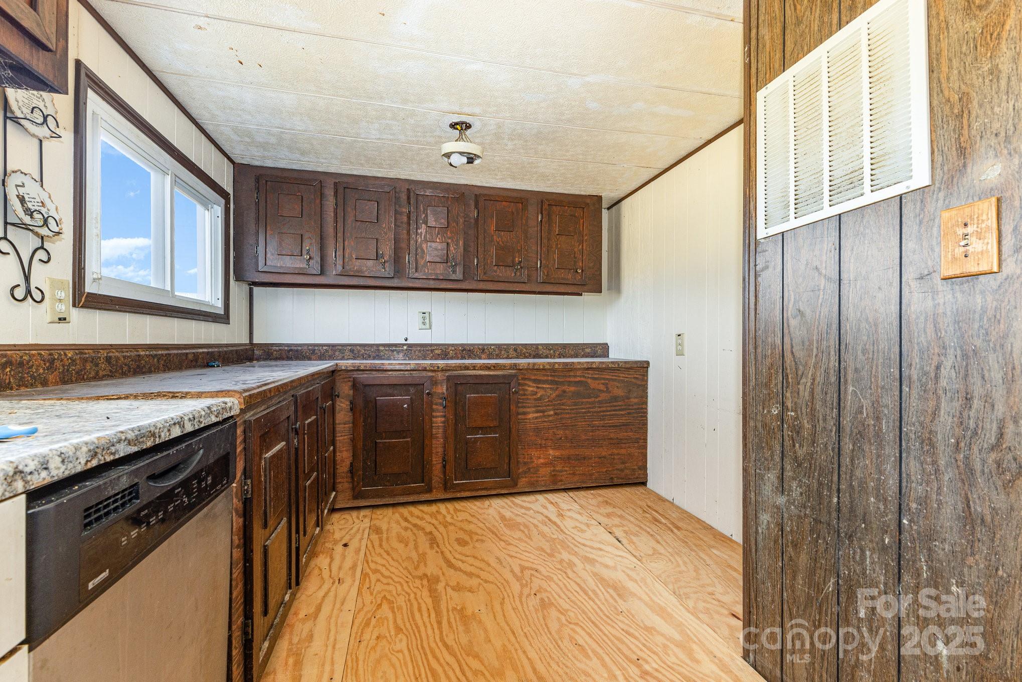 610 Osteen Road York, SC 29745 - Photo 11 of 42 a kitchen with stainless steel appliances granite countertop a stove a sink and a refrigerator