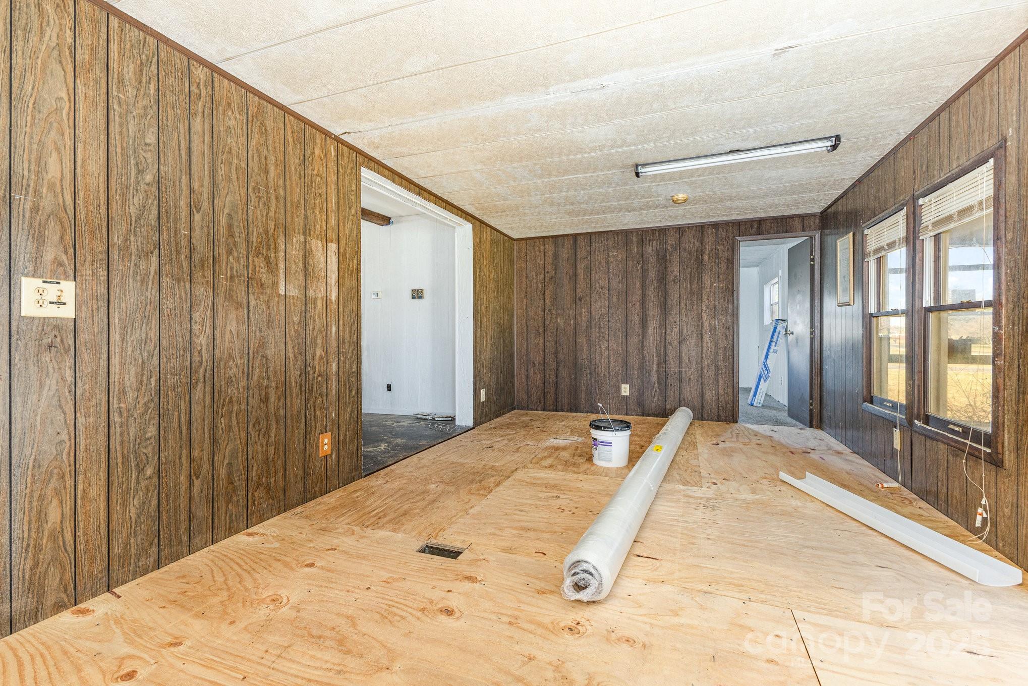 610 Osteen Road York, SC 29745 - Photo 22 of 42 a bedroom with a bed and large windows