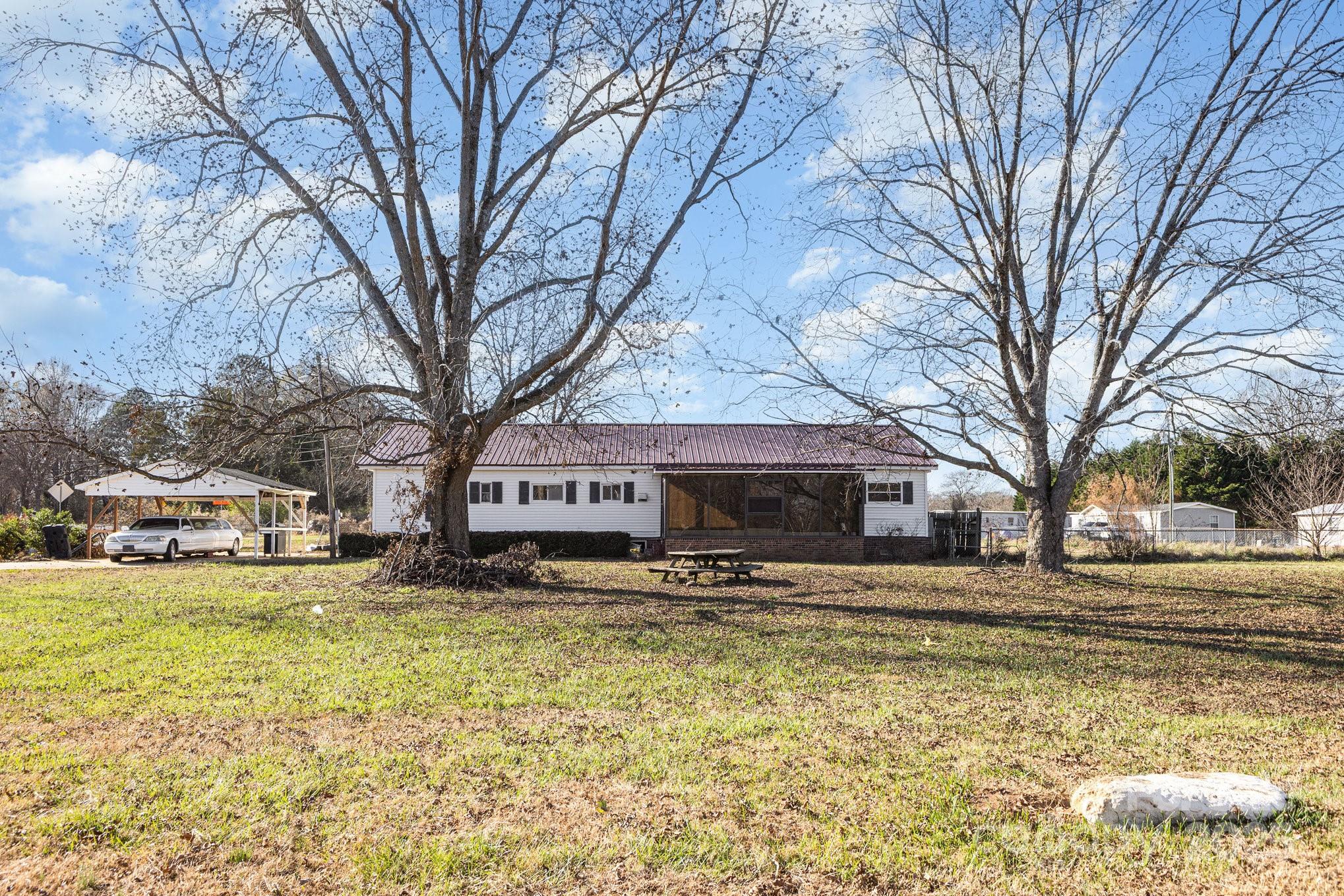 610 Osteen Road York, SC 29745 - Photo 33 of 42 a house with trees in front of it