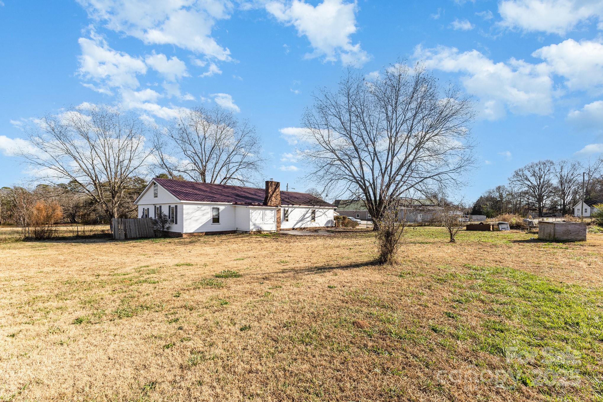 610 Osteen Road York, SC 29745 - Photo 38 of 42 a yellow house that has a tree in front of it