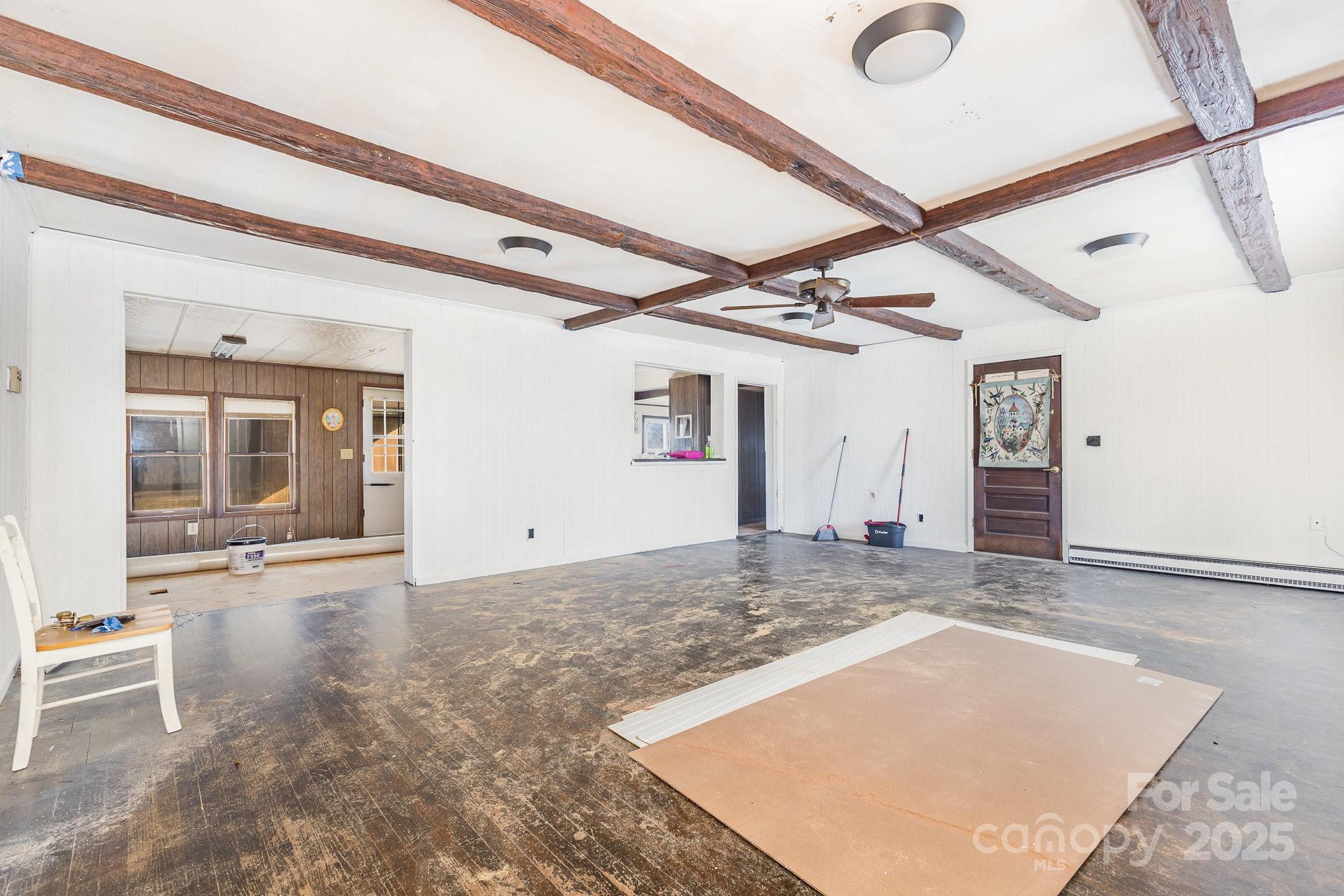 610 Osteen Road York, SC 29745 - Photo 7 of 42 a view of a hallway with wooden floor and chandelier
