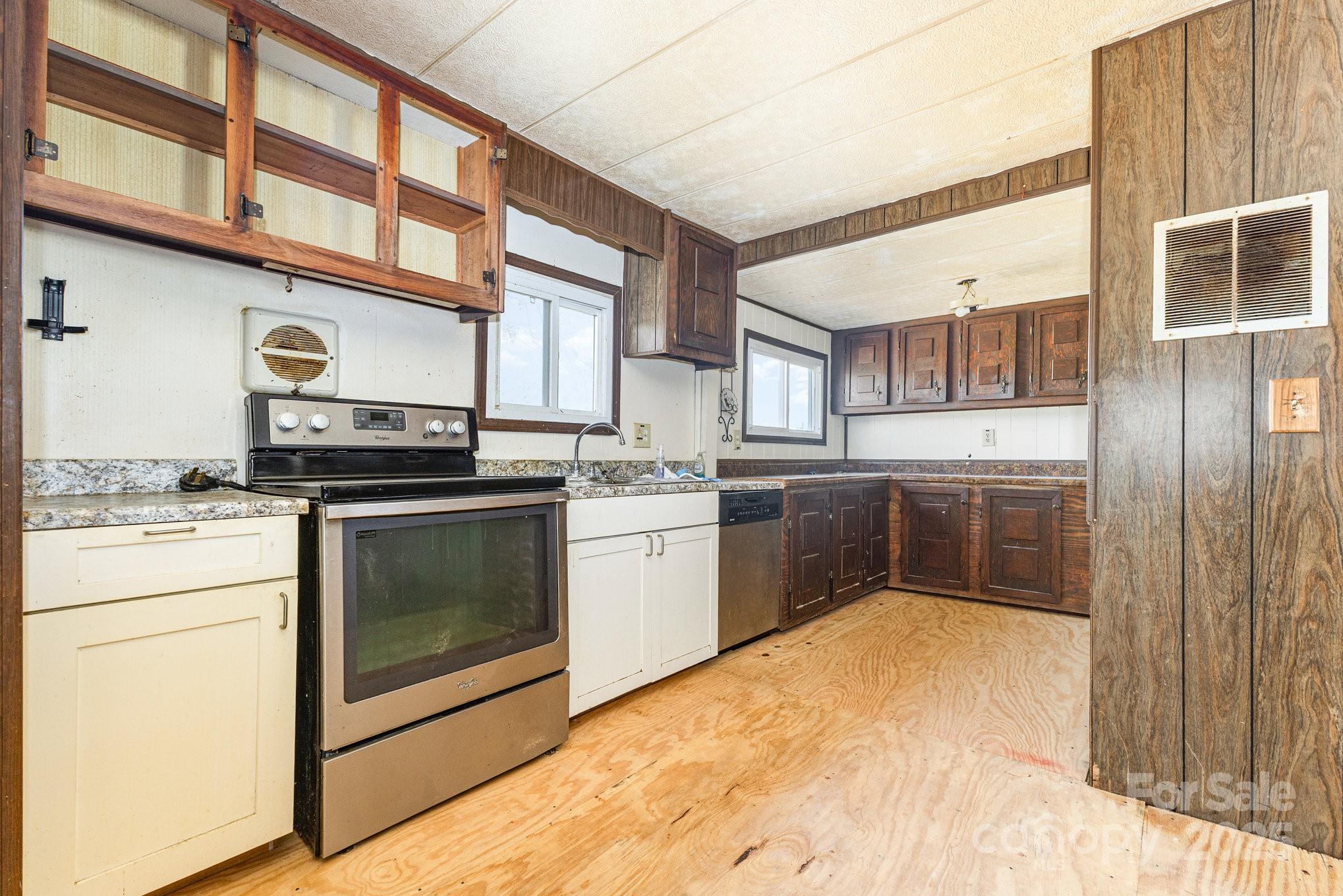 610 Osteen Road York, SC 29745 - Photo 10 of 42 a kitchen with stainless steel appliances granite countertop a stove a sink and a refrigerator