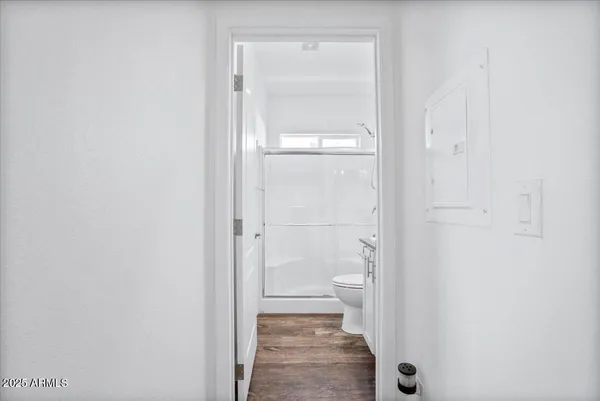 a bathroom with a glass shower door