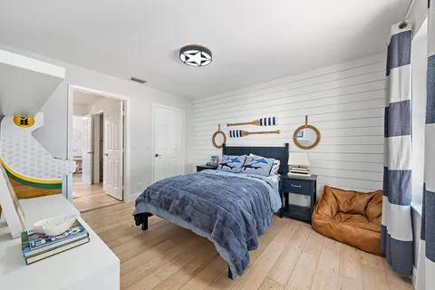 a bedroom with a bed and couch