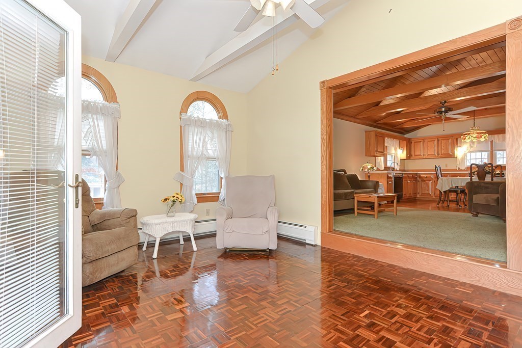 142 Middleboro Road Freetown, MA 02717 - Photo 11 of 42 a living room with couches and a dining table with wooden floor